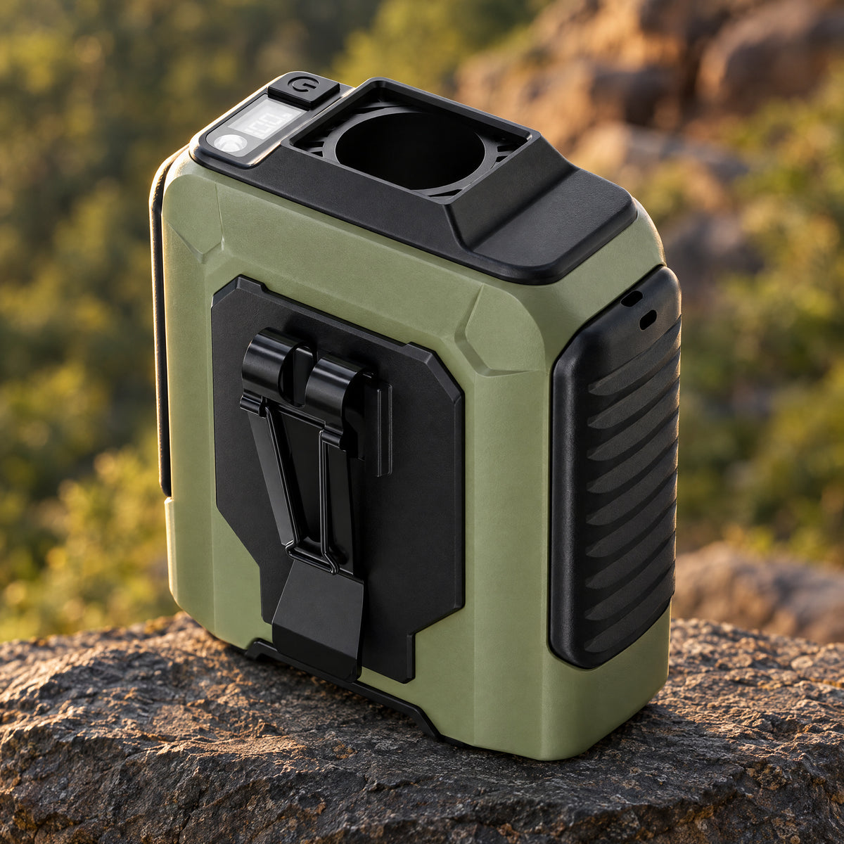 Portable Tactical Fan in Ranger Green on a stone ledge outdoors